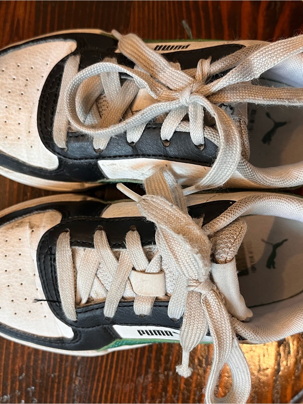 Puma Kids Black and White Low-Top Sneakers with Green Accent